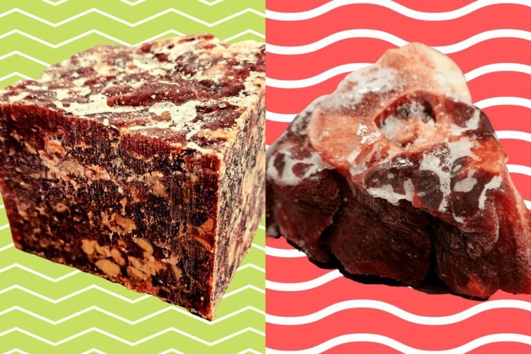 A frozen block of Feed Raw mince beside a raw beef neck bone